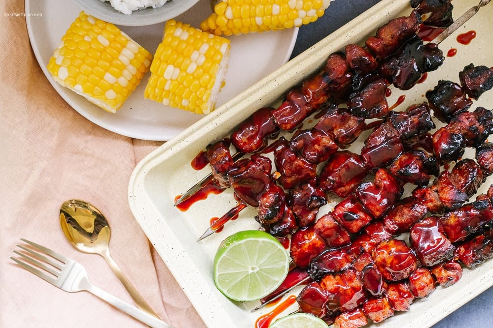 filipino bbq pork skewers with corn, lime and rice