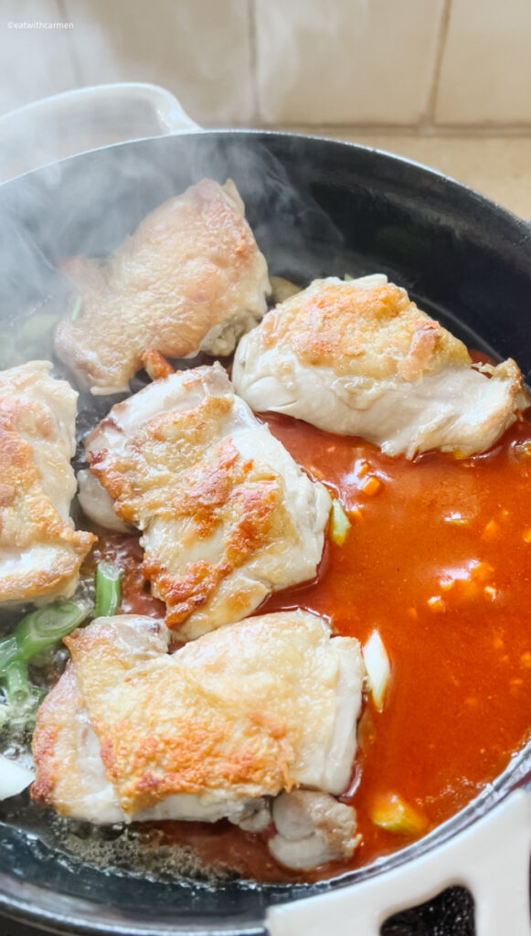 add sauce to crispy chicken thighs