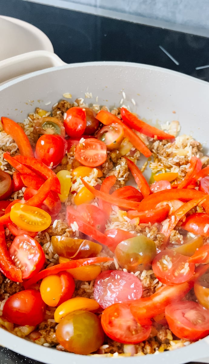 add the tomatoes and red bell pepper
