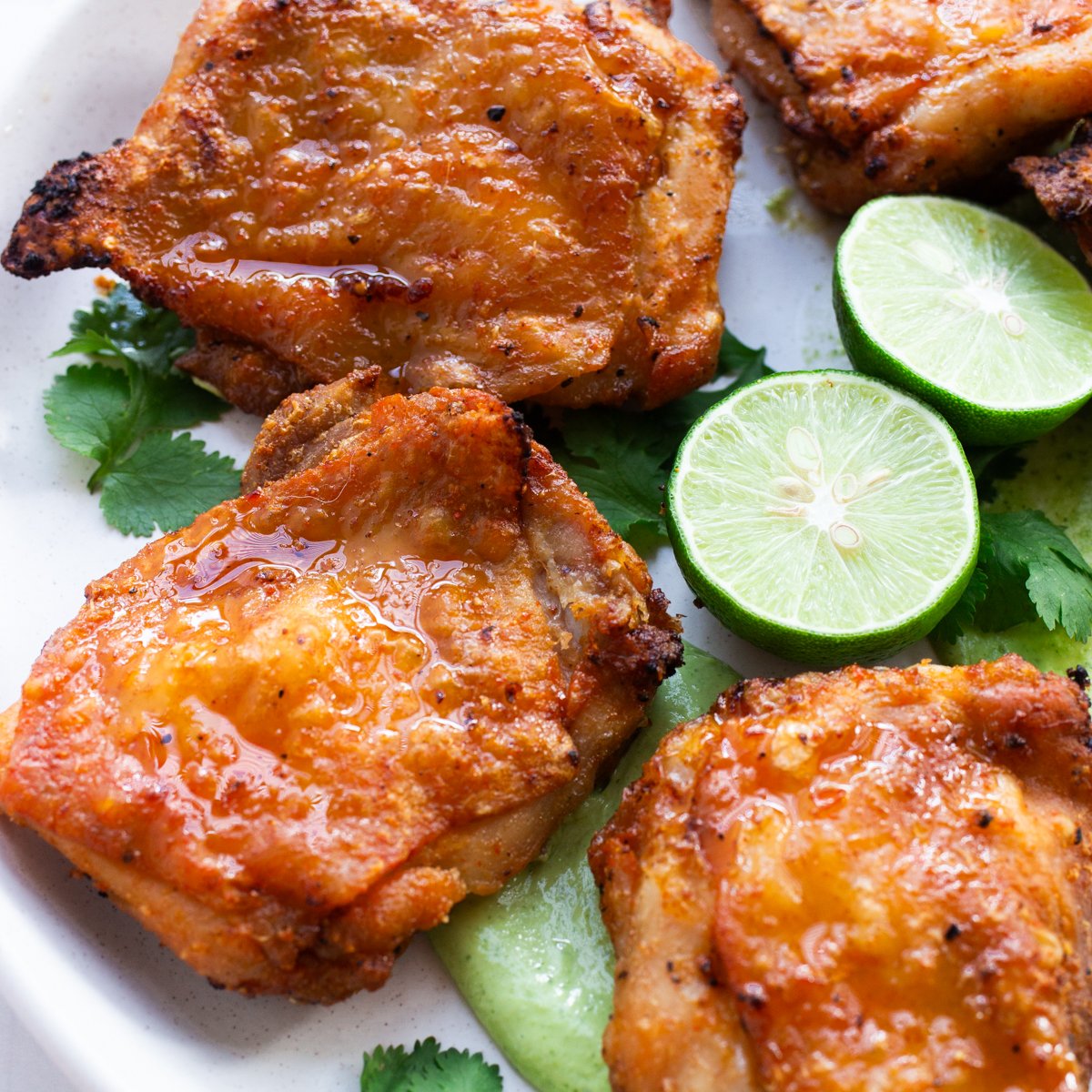 crispy air fryer chicken thighs with avocado sauce