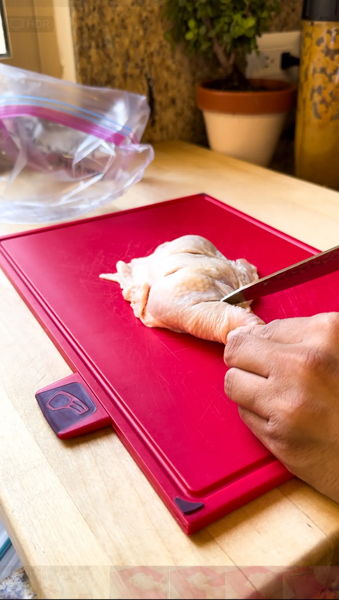 Cutting chicken legs for Kalbi chicken recipe