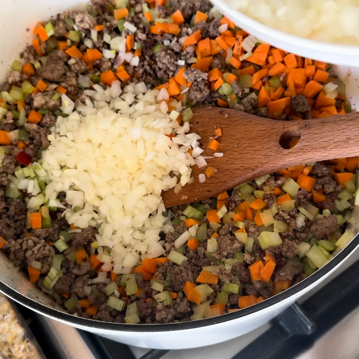add aromatics to ragu